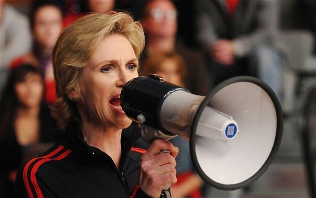 Still maintaining the same snarky demeanor, she is now of course the beloved/hated Sue Sylvester of Glee.