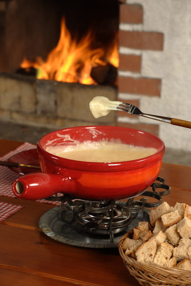 Spread a blanket out in the living room. Make some s'mores on the stove and set up a nice fondue pot.