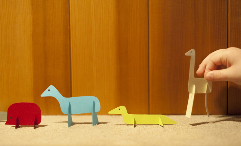 Slotted paper animal toys - cheap, simple, easy. And will entertain your kid for at least 20 minutes.
