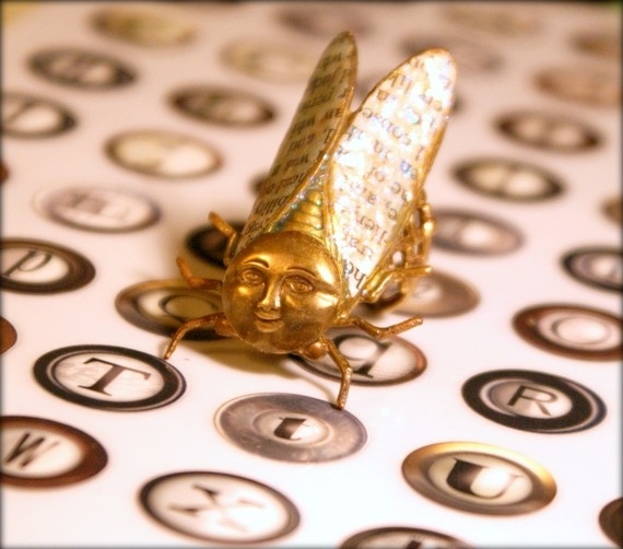 Yes, this is a cicada ring with a human face. What's your question?