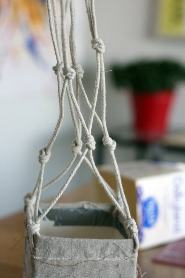 Gather all the strings together at the very top and knot all of them together.