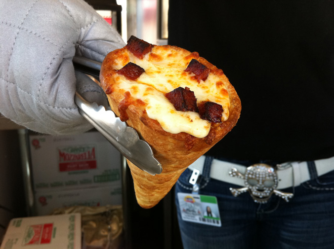Location: Florida State Fair 2013The legendary Pizza Cone has been around for a while now, but this year the Pizza Cone made an appearance at the Florida State Fair way back in February (we get it Florida…you’re warm, but you’re weird). I know what you’re thinking and YES. Pizza can be sexy.