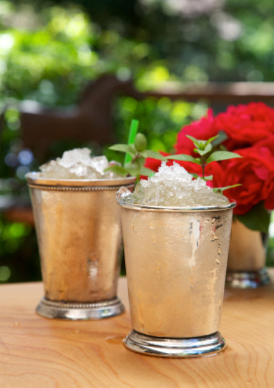 The mint julep's oldest relative is the Arabic julab, a medicinal drink made with water and rose petals. Europeans eventually traded that in for mint and booze. And later, Americans added bourbon whiskey into the mix. In 1803, the British historian John Davis was the first to record the mint julep's existence in print, defining it as a morning drink. So when you drink mint juleps before noon, just cite history and say, "British historian John Davis wrote that this is how the Virginian farmers did it back in 1803." And everyone will understand why whiskey before noon is smart. Recipe here.