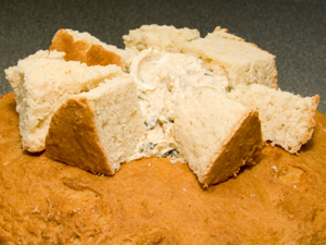 Slow your roll, dynamo. I've got you covered. Take the scooped-out insides, rip 'em up into bite-size pieces, and throw them in a bowl to use later as the perfect snack at that cool, hip party you're hosting. Add some hummus or warm spinach-artichoke dip and you've doubled the lifespan of your bagel! You're a goddamn bagel hero.