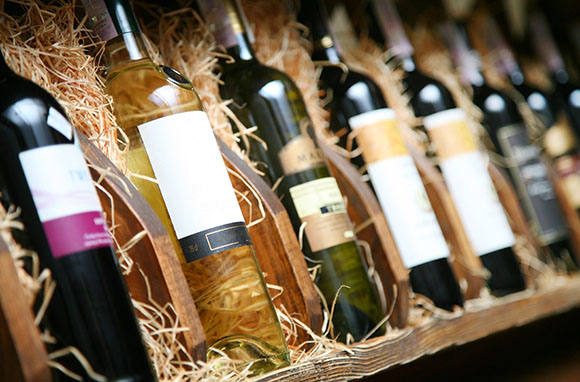 Suitcase-stashed wine bottles that break in transit will turn your crisp white shirts into soggy red ones. So keep your wine in its container with some protective packing strategies. Travel expert Chris Gray Faust, who has written about how to pack wine, gave us some advice about buying wine overseas and then getting it back home: "My main tip is to buy thoughtfully. Ask the winery for their distributor list to see if anyone in your city or state carries it (there's no sense buying wine overseas that you can buy down the street). And think about how you'll get the wine home before you go. If you're the type who is content with a bottle or two, pick up some bubble-wrap style WineSkins either before you go or while you are there. Serious aficionados might want to invest in a stainless-steel wine suitcase built to withstand the extreme temperatures of the airplane's cargo hold."