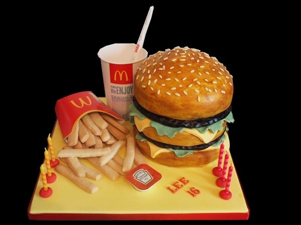 Complete with french fries, a drink, and ketchup.