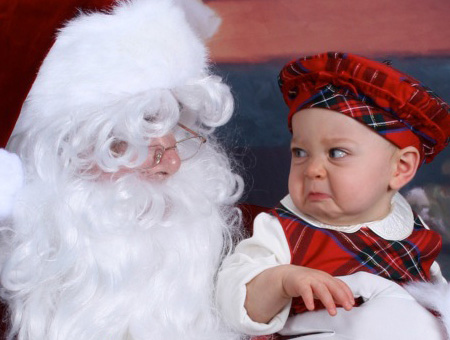 This baby (with an amazing hat) knows what true evil lies behind those twinkling eyes and that snow white beard. "Santa Claus?" AS IF THAT IS EVEN YOUR REAL NAME YOU FOOL.