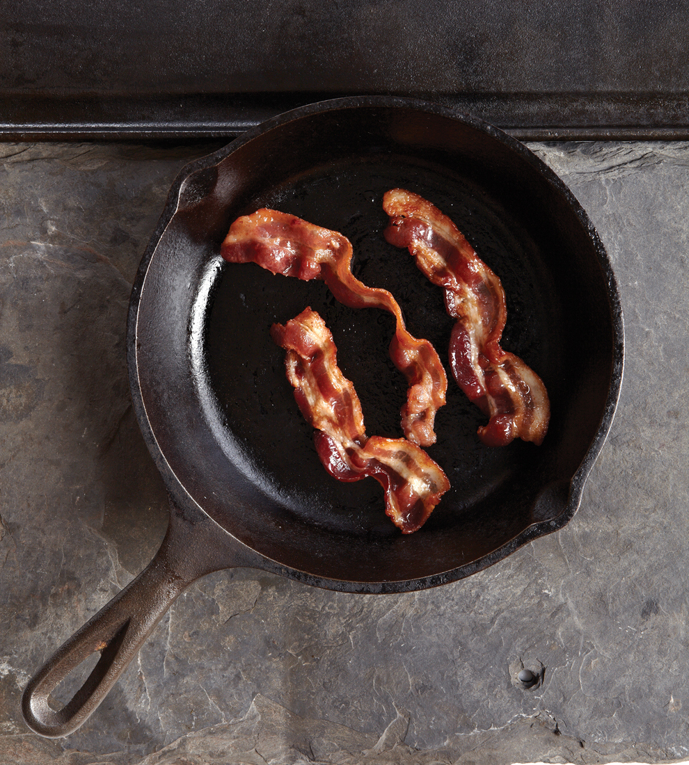 1. Buy bacon. 2. Saute it. 3. Once the bacon is out of the pan, pour the drippings into a heat-proof bowl. The brown bits will sink to the bottom. Some people like to use those brown bits when they cook with bacon fat, because the bits are full of flavor. Some people like to strain them out through cheesecloth or a coffee filter. 4. Store bacon fat in a covered jar in your refrigerator and use within 3 months.