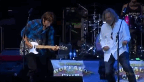 ...and play air guitar with members of Creedence Clearwater Revival.