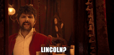 John Wilkes Booth, played by Adam Scott, ponders over Lincoln's ambitions.