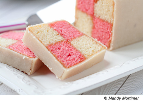 Created in 1884 to celebrate the marriage of Queen Victoria's granddaughter and namesake to the Prince of Battenberg, this checkered cake (also called "church window cake") can be customized with different colours and flavours although it is traditionally pink and yellow. It takes a wee bit of jiggery-pokery to look perfect, but Mandy Mortimer from What the Fruitcake? makes it look easy in her beautiful tutorial with recipe here.wee = littlejiggery-pokery = tinkering, messing about with