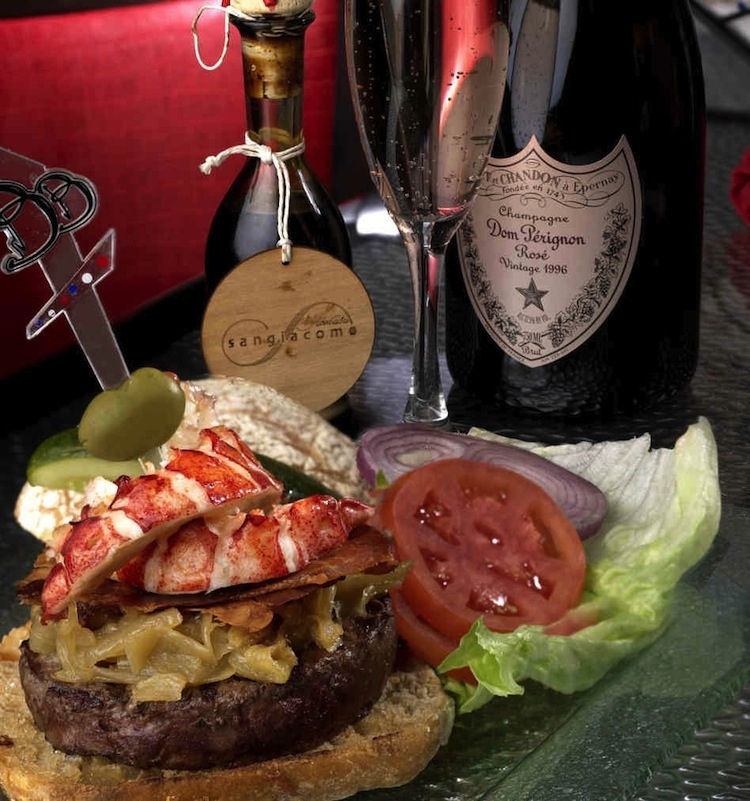 This burger features the typical pricey works: lobster, imported brie, prosciutto, and 100-year aged balsamic reduction. But the main reason for such a pricey check? (drum roll please) a bottle of Dom Perignon with every burger!