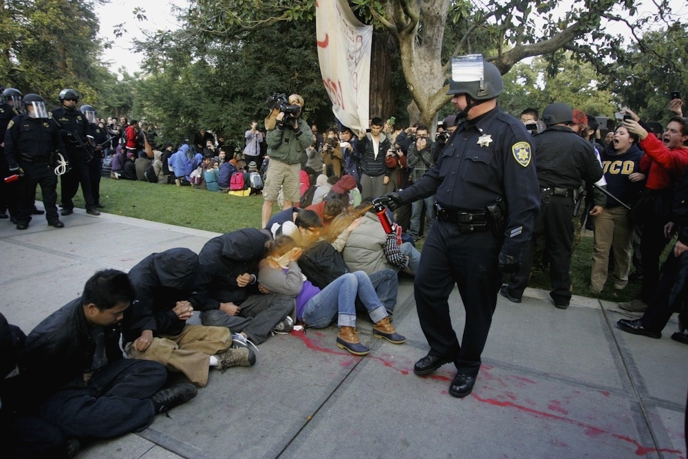 Pike pepper-sprays students during their sit-in at an "Occupy UCD" demonstration in Davis, California on November 18, 2011.