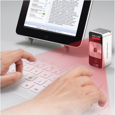 It's a holographic laser keyboard for your iPad, iPhone or Android. It saves space by not making you carry around an actual keyboard blah blah blah WHO CARES?! LASERS!!! It's 2013, you guys, and we are straight-up living in the future.