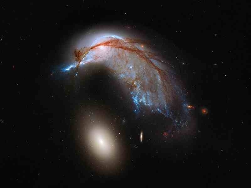 This stunning image is the result of a galaxy collision a staggering 326 million light years away.Click the link below for more information.