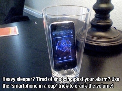 If you&#39;re a heavy sleeper, putting your phone into a glass will amplify the sound.