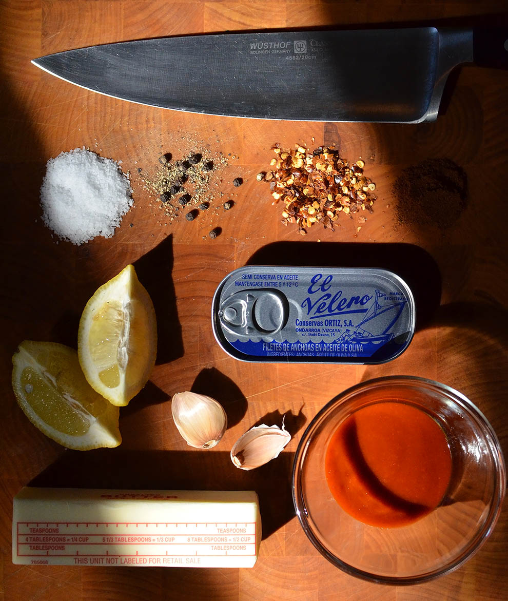 You will need: 2 sticks of butter2 cloves garlic2 anchovy fillets Juice of 1 lemonZest of 1 lemon2 tablespoons Sriracha2 teaspoons red chili flakes1/4 teaspoon cayenne pepper (or ancho chili powder, like I used)