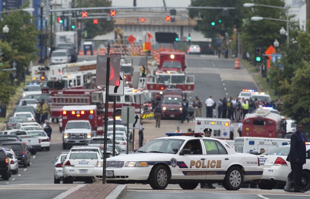 Police and firefighters respond to the report of a shooting at the Navy Yard in Washington.