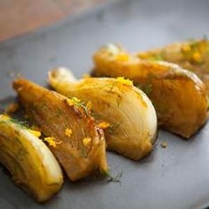 Seared in butter and then given a quick stove-top braise, these luscious bites get a refreshing jolt from orange zest. Pile them beside roast pork or steamed fish!
