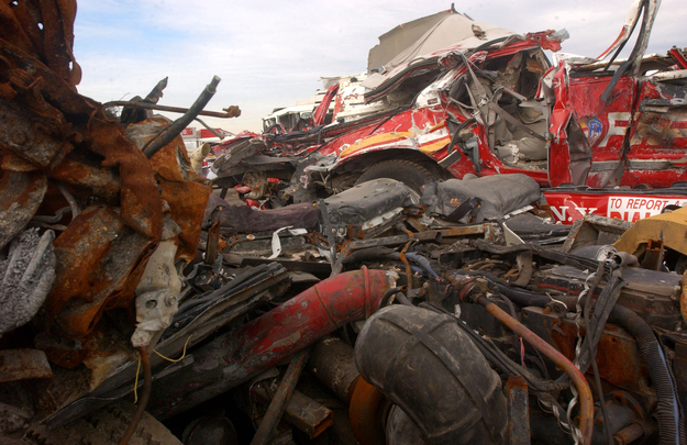 Destroyed New York City Fire department trucks sit at the Fresh Kills landfill January 14, 2002 in the Staten Island borough of New York City. All debris from World Trade Center disaster site are brought to the landfill where investigators examine them for evidence, property and the remains of victims.