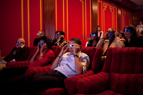 Michelle's gettin' into it too! This was taken during the White House Super Bowl party, but we can also imagine this is how Obama and his cool friends watch the nightly news.