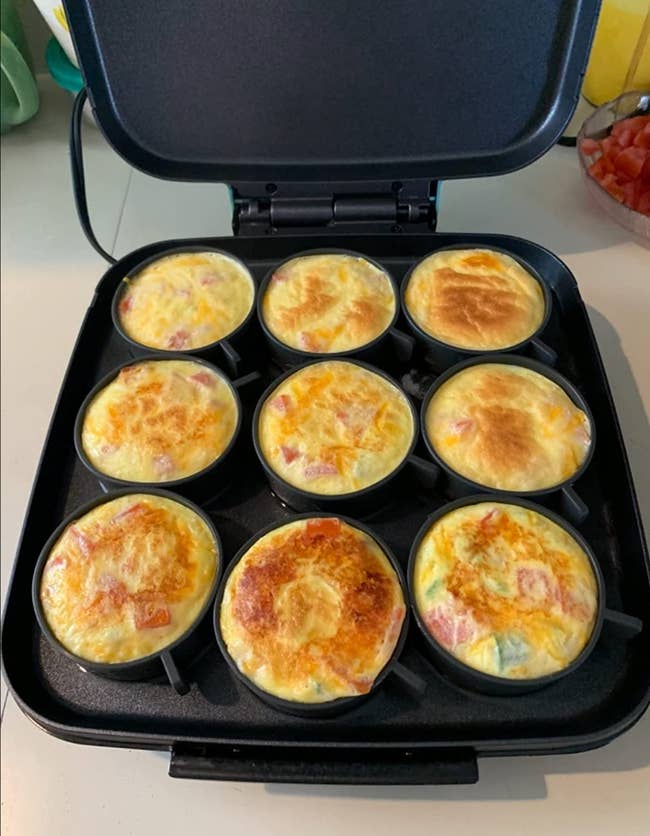nine round egg bites cooked in a small grill 