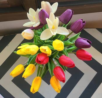 a top view of a vase of tulips