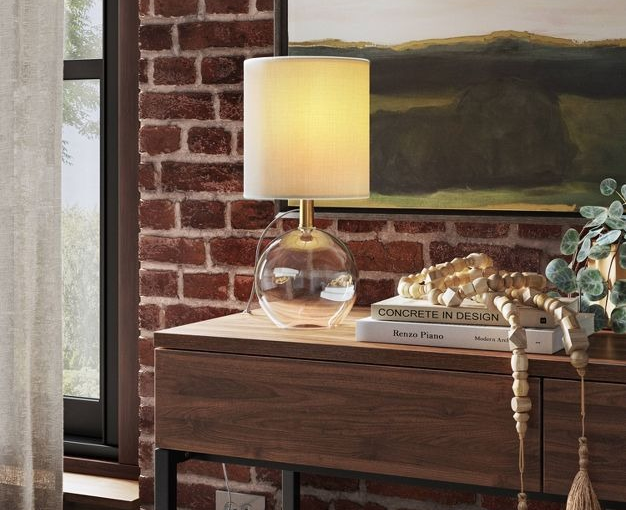 lamp turned on sitting on table 