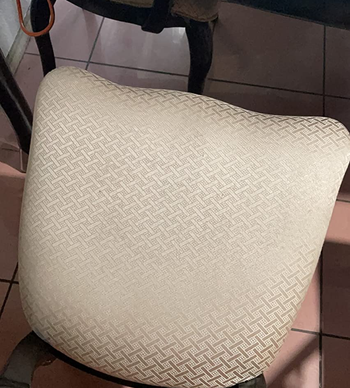 same reviewer's after photo showing the beige seat looking good as new after being cleaned with the little green