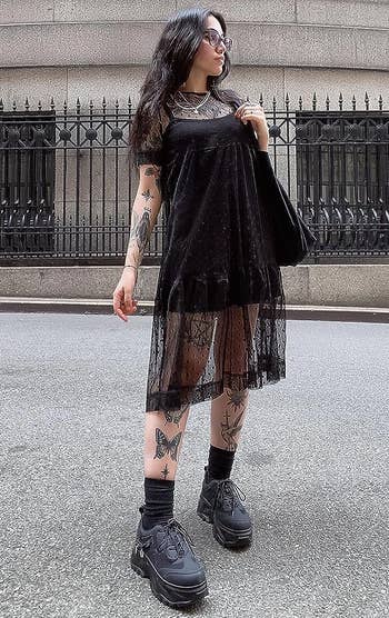reviewer successful the screen up formal with a mini achromatic formal underneath