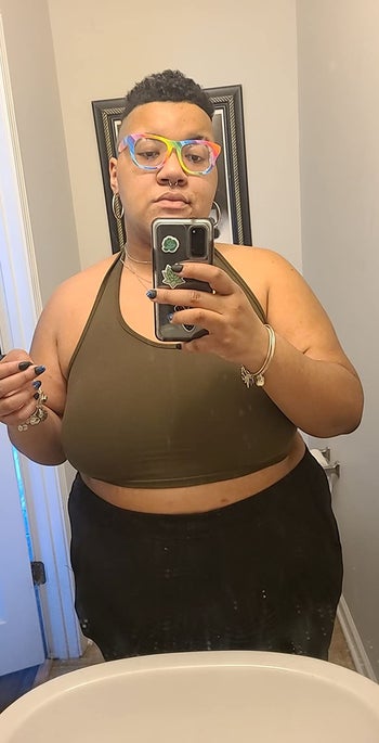 reviewer mirror selfie wearing olive green halter tank top