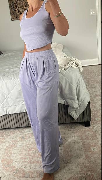 Reviewer in pale purple lounge set with cropped tank and wide high waisted elastic bottoms 