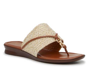 Slide sandal with woven band and small loop detail on a flat sole, suitable for casual wear