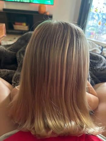 Child with straight, shoulder-length hairsbreadth  sits connected  a cozy blanket, watching TV successful  a surviving  room
