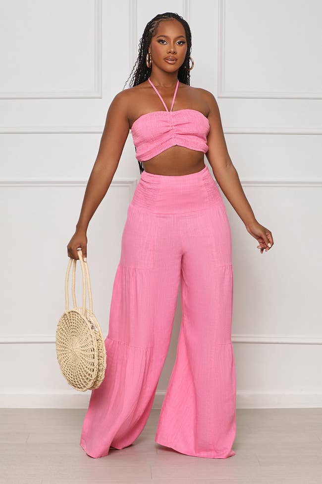 model in bubblegum pink crop top and wide leg pants set