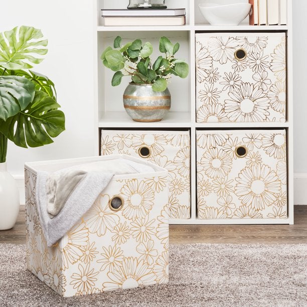 White with gold floral storage cubes in a shelf