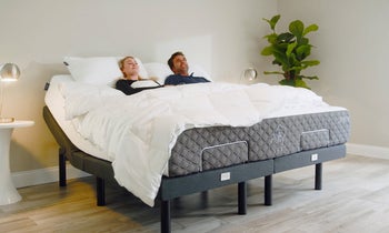 couple lying in mattress on adjustable bed