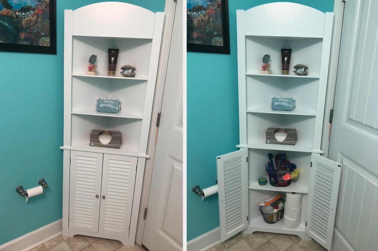 White corner cabinet in bathroom with toiletries in cupboard 