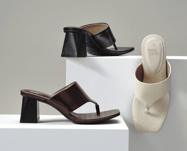 Three stylish heeled sandals are displayed: two with open toes and thick heels, one in black-brown, one beige. Suitable for fashionable spring wear