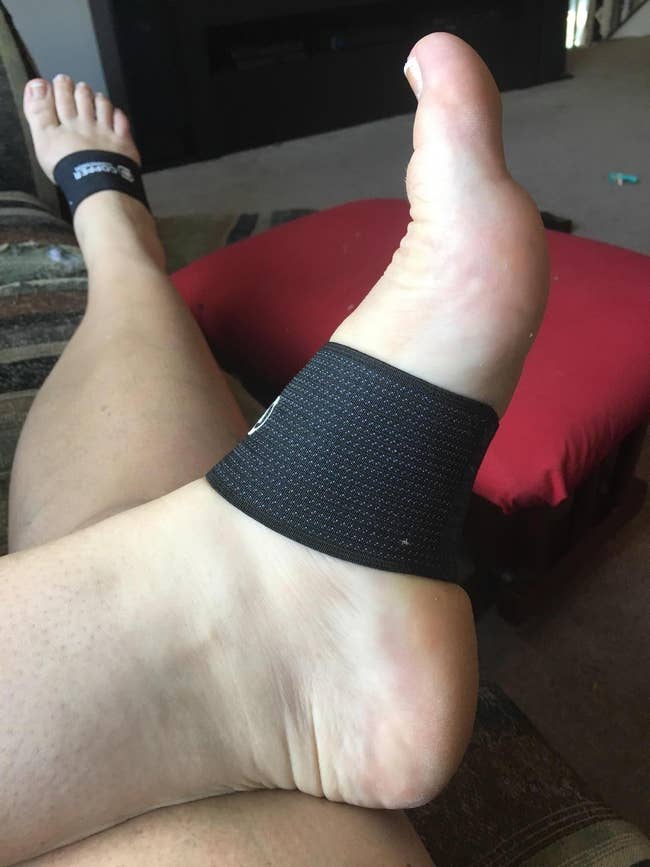 a reviewer's feet wearing the arch support bands on 