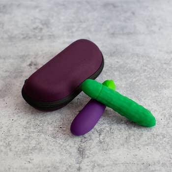 Purple zip case next to eggplant and pickle vibrators