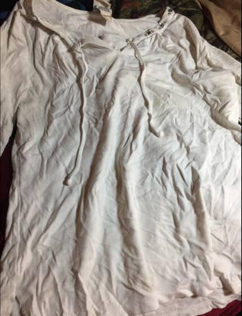 Reviewer's wrinkly white shirt