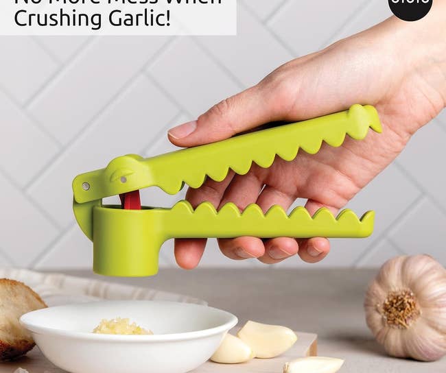 garlic press with handles shaped like a gator mouth