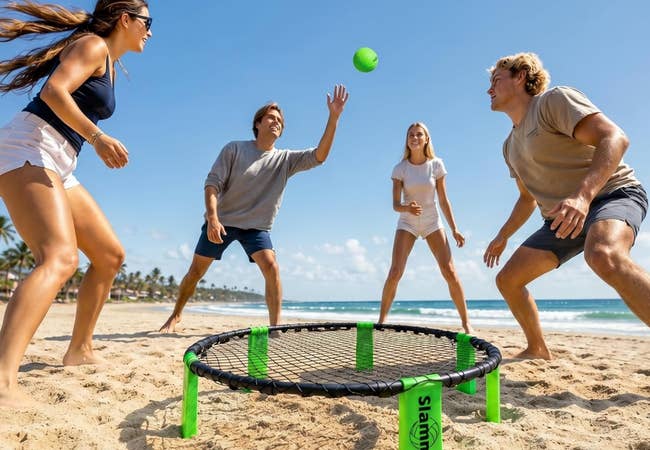 Four radical playing a lively crippled of Spikeball connected a beach, highlighting outdoor amusive and competitory play