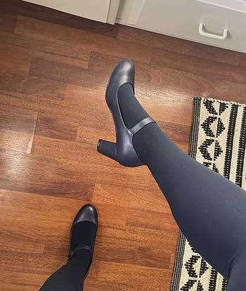 reviewer wearing the navy mary janes with tights