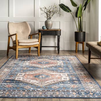 Image of the blue rug next to a table and chair