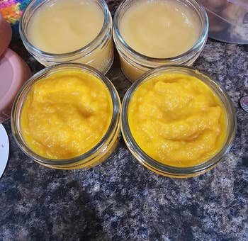 another reviewer showing four jars of food they made with the baby food maker