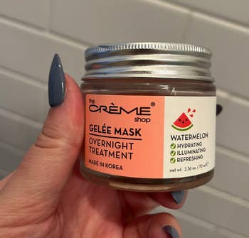 Hand holding a jar of The Crème Shop gelée mask with watermelon for overnight treatment