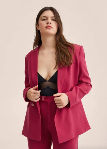a model in the pink blazer