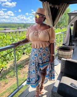 another reviewer wearing the blue pattered skirt